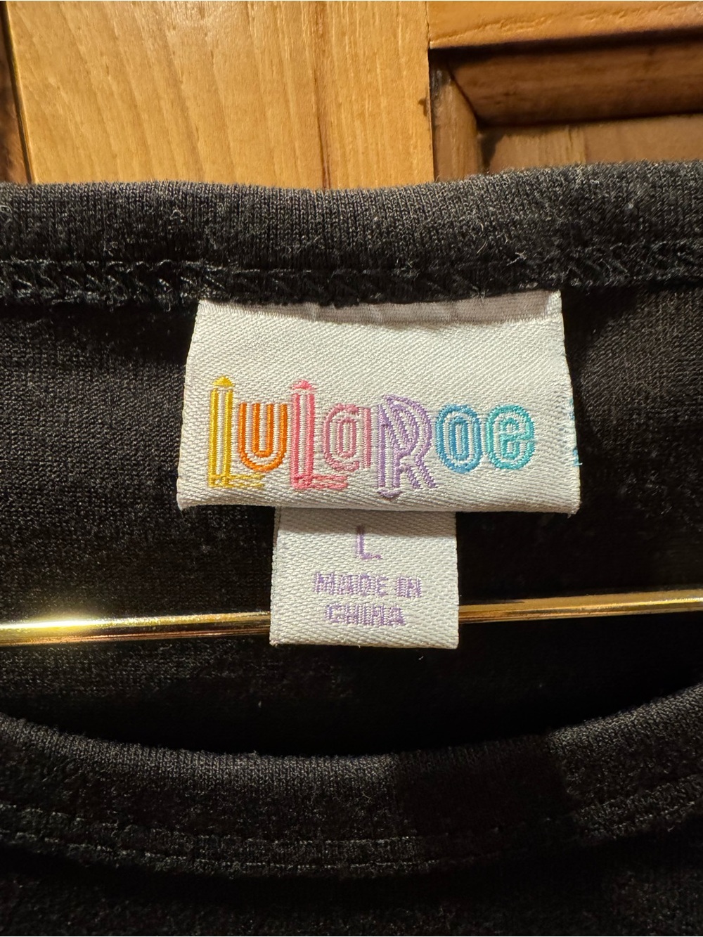 LuLaRoe Black Top with Gold and Green Rose Raglan Sleeves - Picture 3 of 5
